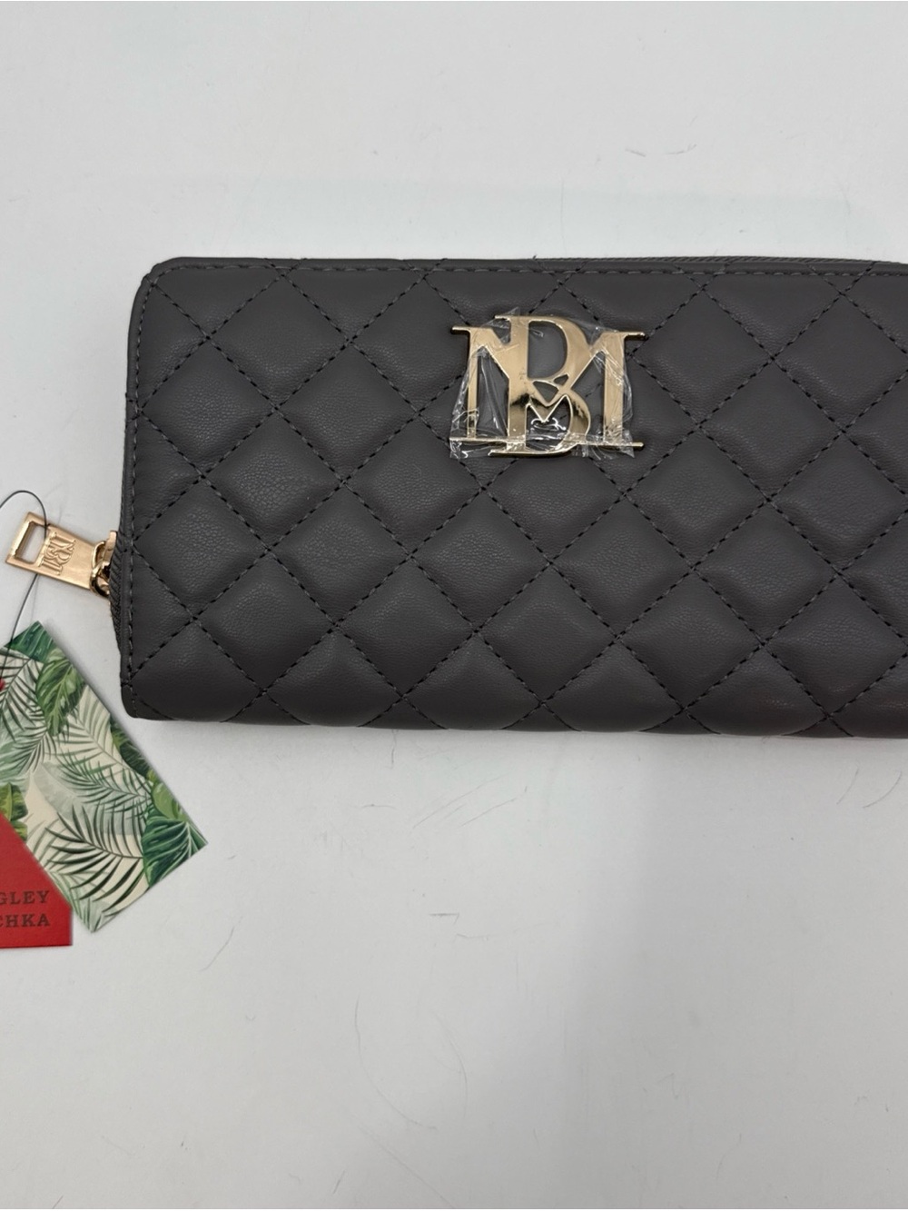 Quilted Dark Gray Zip-Around Wallet with Gold Emblem